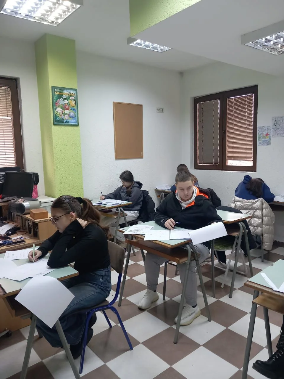 Students solving questions in a bright classroom