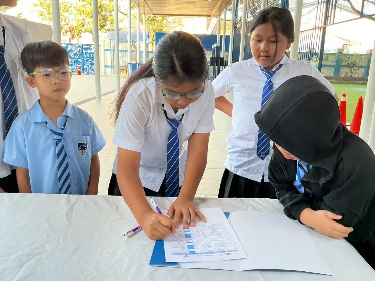 Students checking their tournament registration together